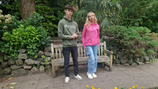 Image showing man and woman wearing Gymate branded designer hoodies 